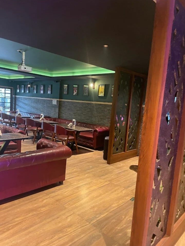 Lounge with carved wooden partition