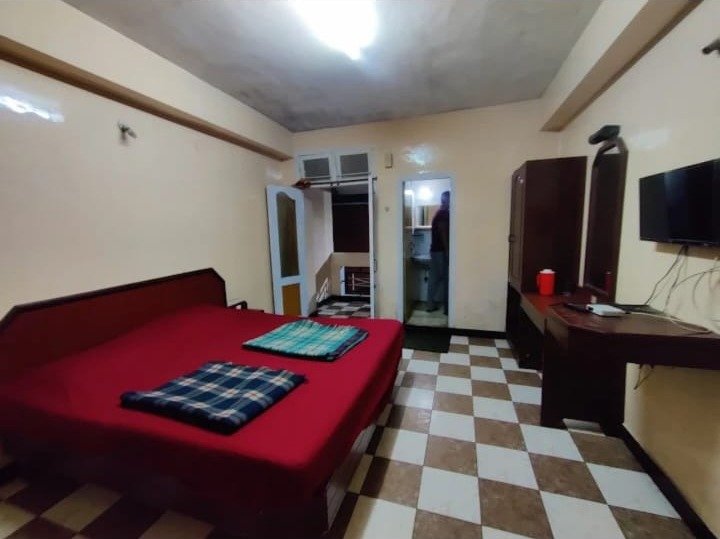 Comfort room with TV and attached bathroom